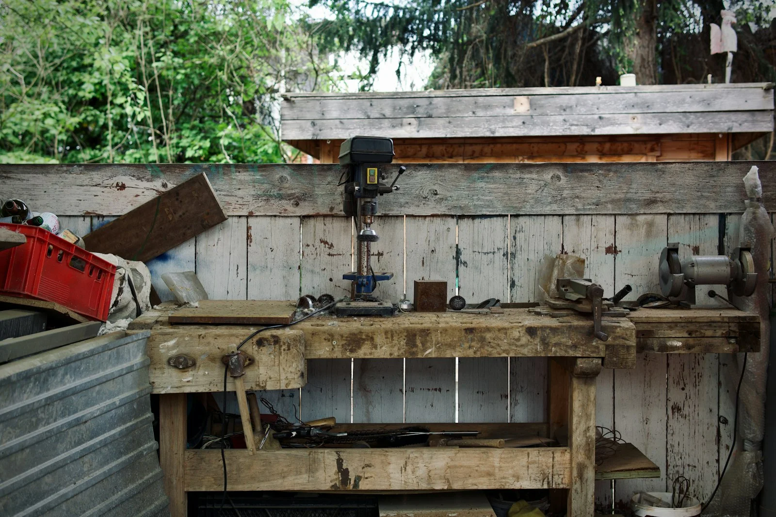 A calm timber trades workbench in soft natural daylight, hand tools resting on the bench surface, no people, no signage and no text.
